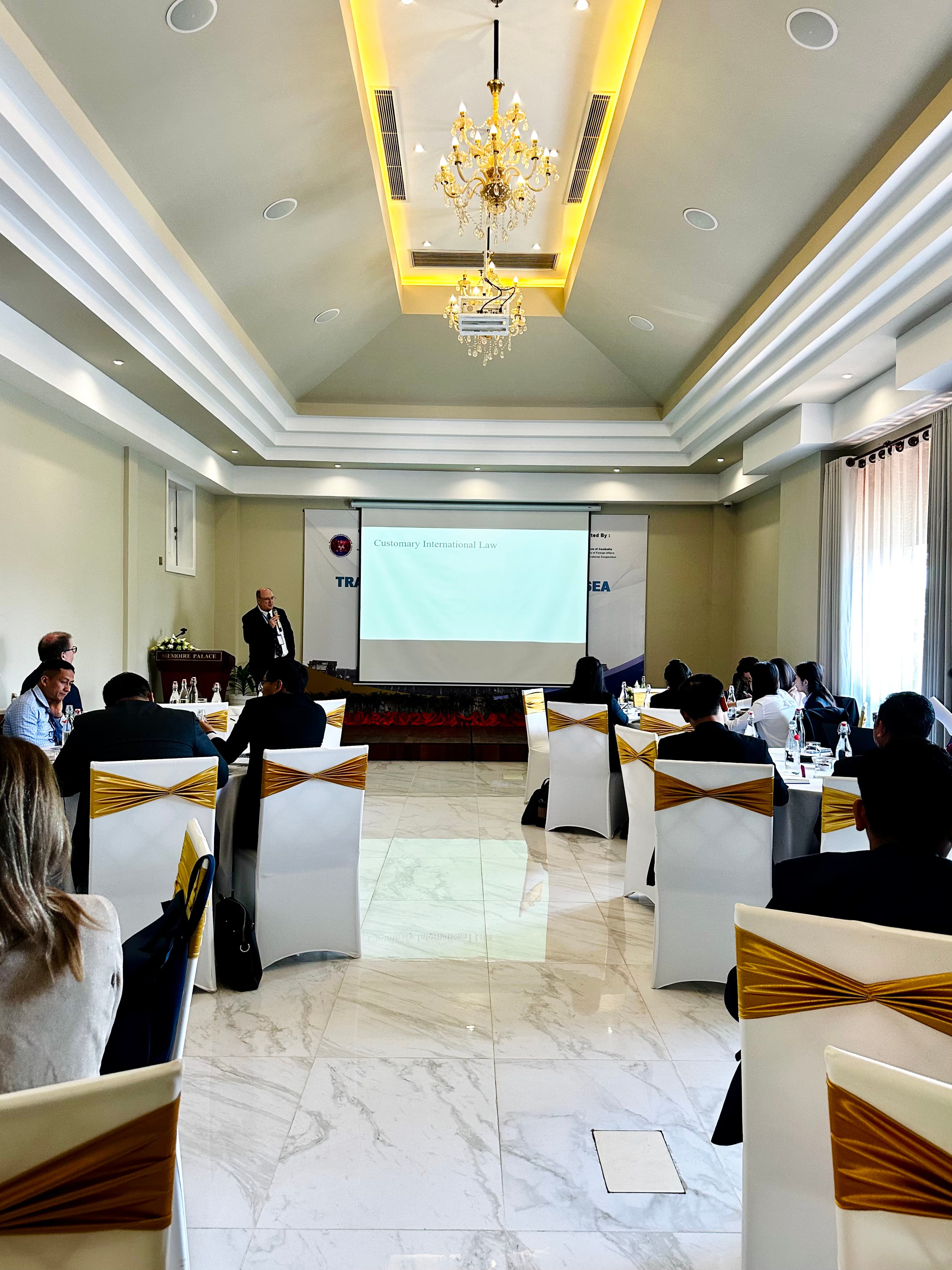 Elegant meeting room with long table and gold chairs